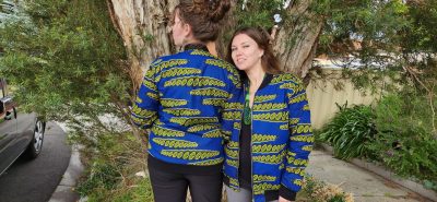 Two girls wearing green and bue geometric print Bomber Jacket Australia
