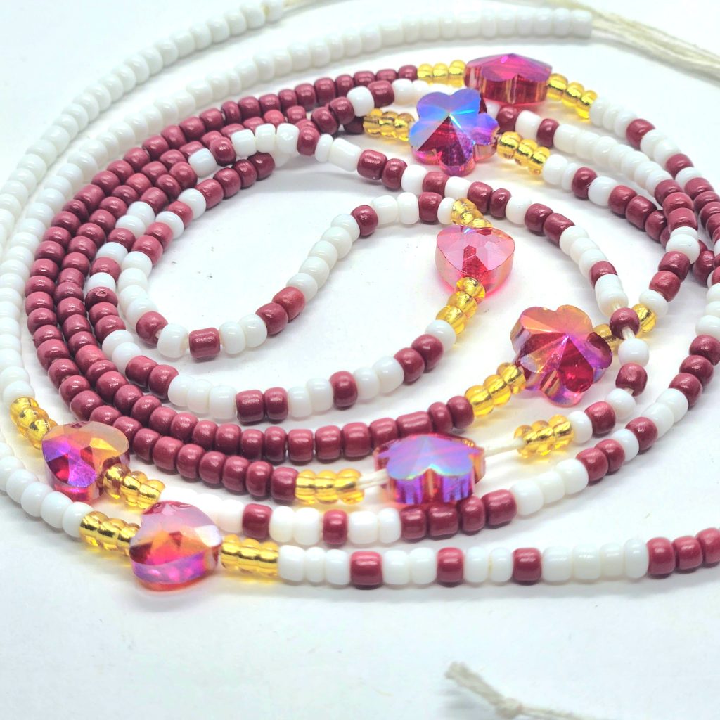 Image of red waist beads with charm by Akos Creative click to view
